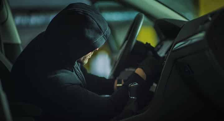 a car thief in action a car thief in action