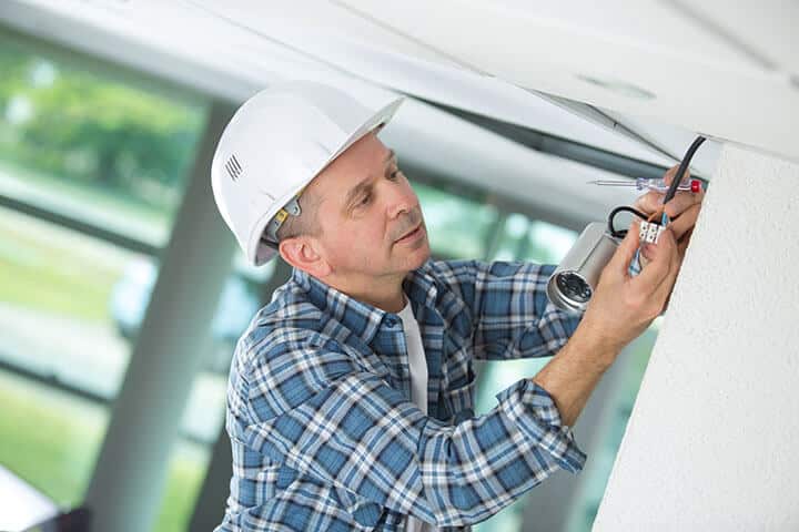 contractor installing a security camera system contractor installing a security camera system