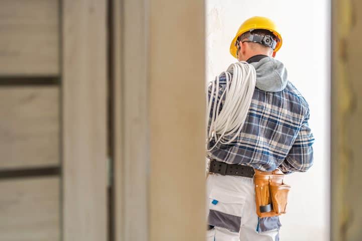 Electrical Systems Installer. Caucasian Electric Technician at Work. Electrical Systems Installer. Caucasian Electric Technician at Work.