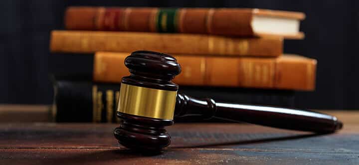 judge gavel on a wooden desk and law books judge gavel on a wooden desk and law books