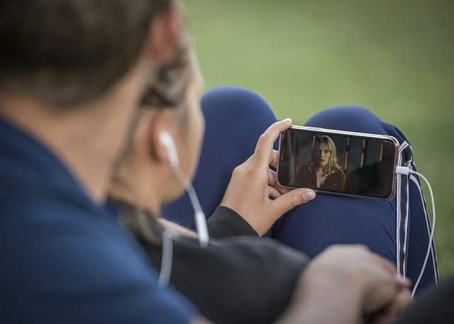 Watching video on a mobile phone Watching video on a mobile phone