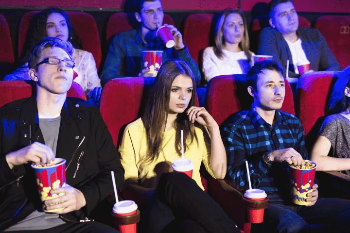 Friends in a movie theater Friends in a movie theater